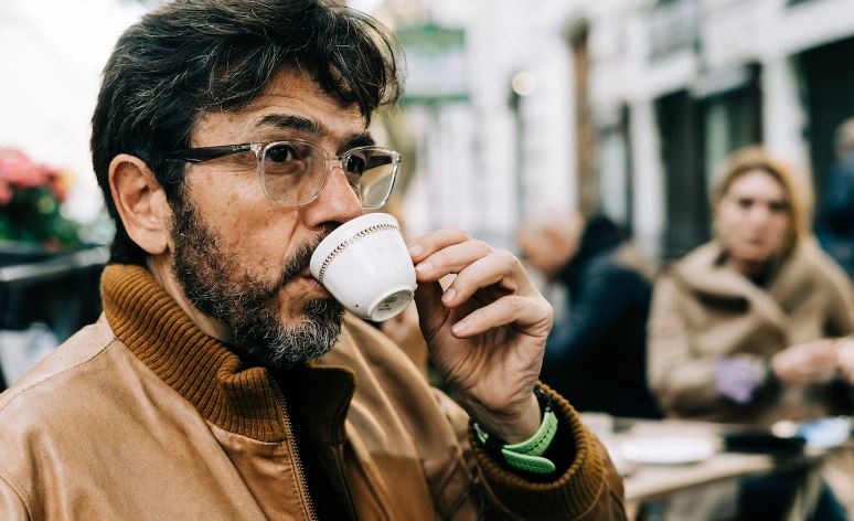 man enjoying his espresso