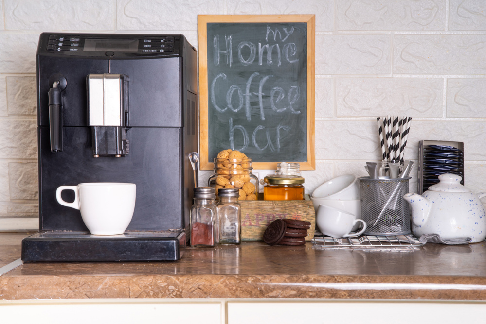 Home Coffee Station, Coffee Bar. kitchen coffee corner with coffee machine, coffee beans, tea, sweets and toppings for drinks