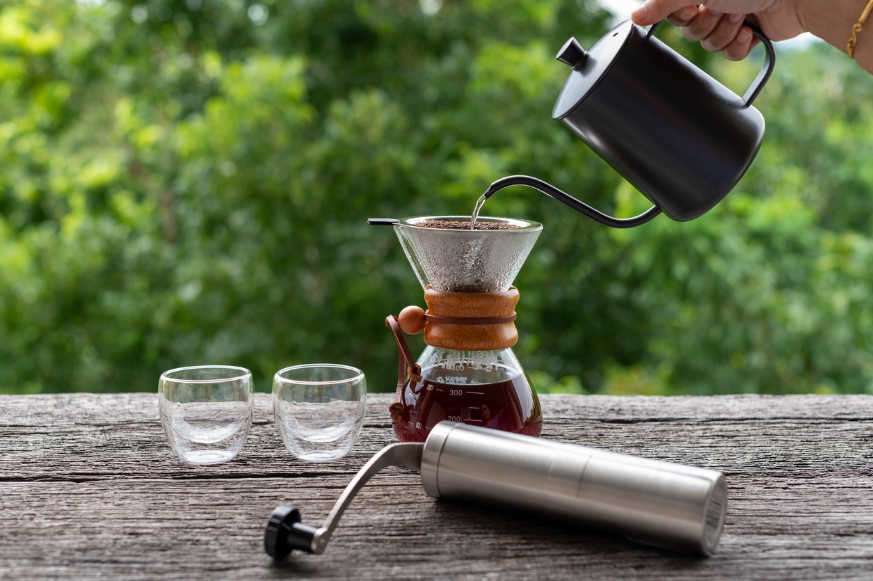 Drip coffee with equipments on wooden table