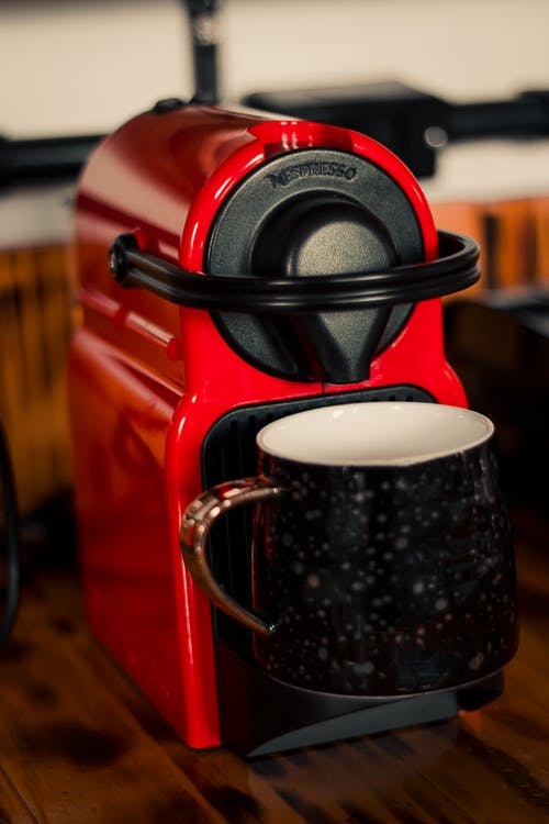 Red and black coffee brewing machine