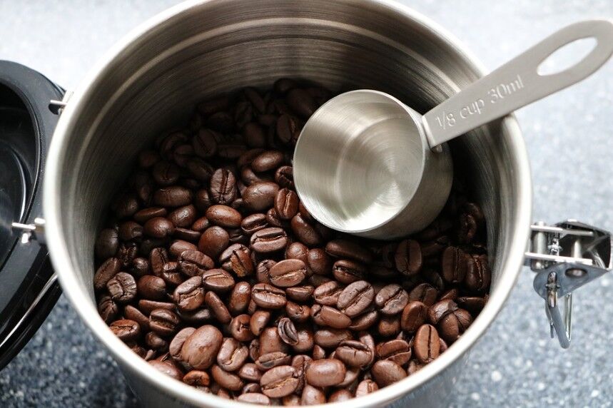 coffee beans in an aluminum airtight coffee container