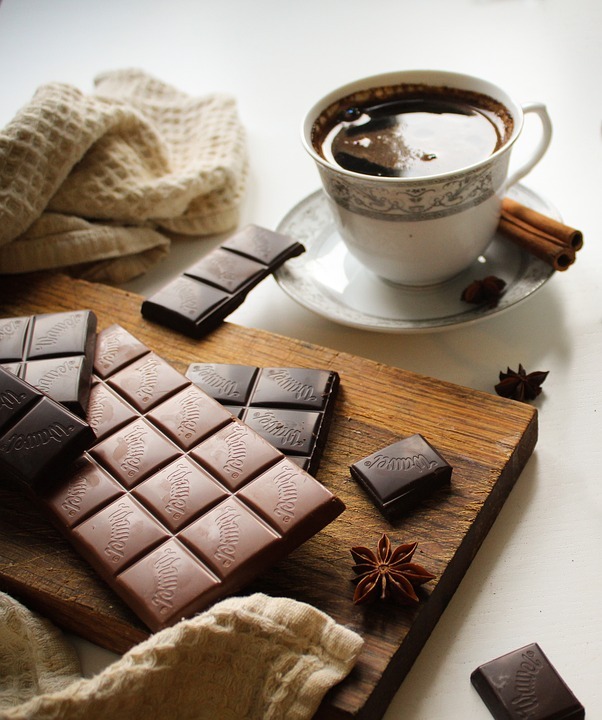 a cup of coffee and chocolate bars