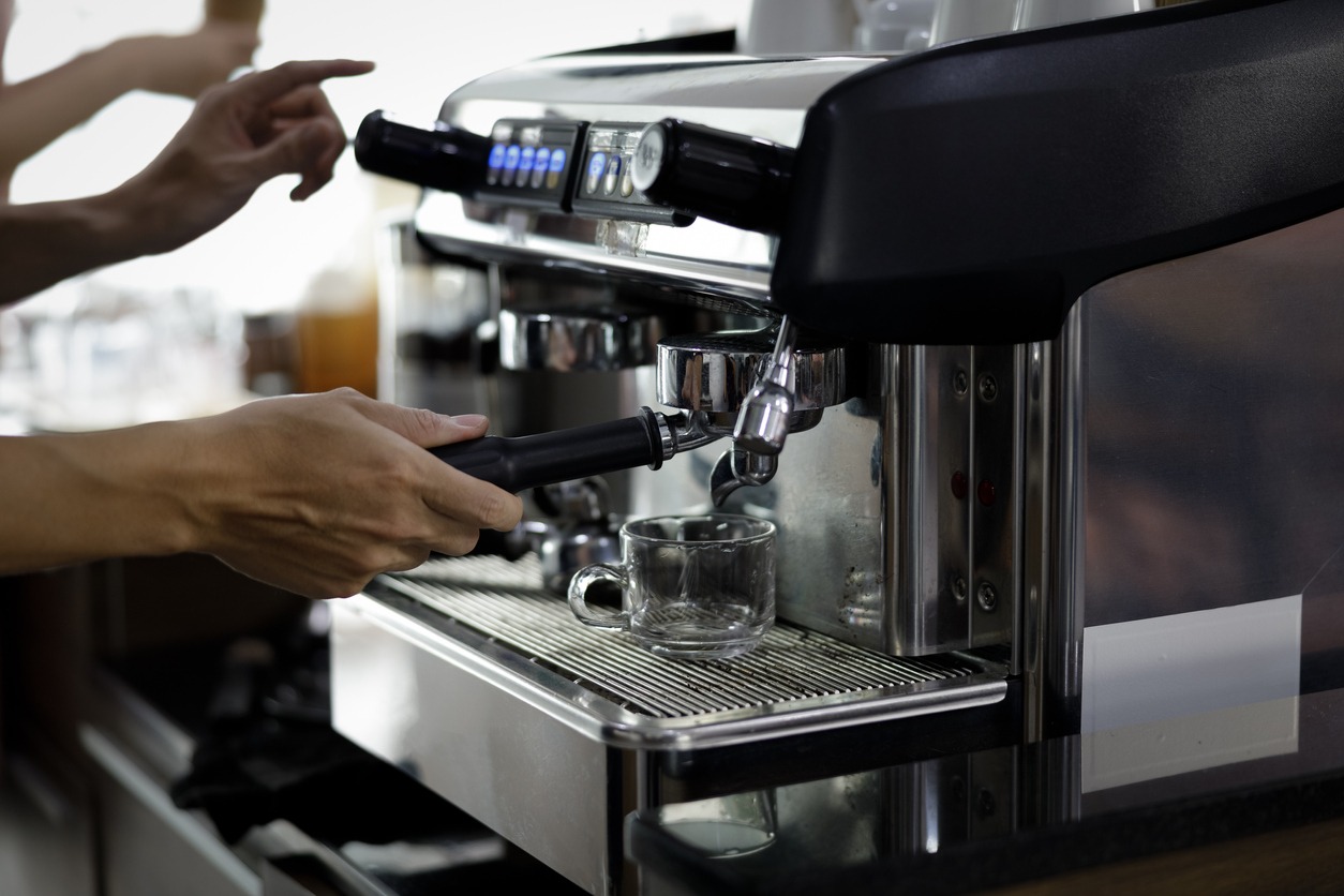 Staff making coffee with coffee machine in cafes