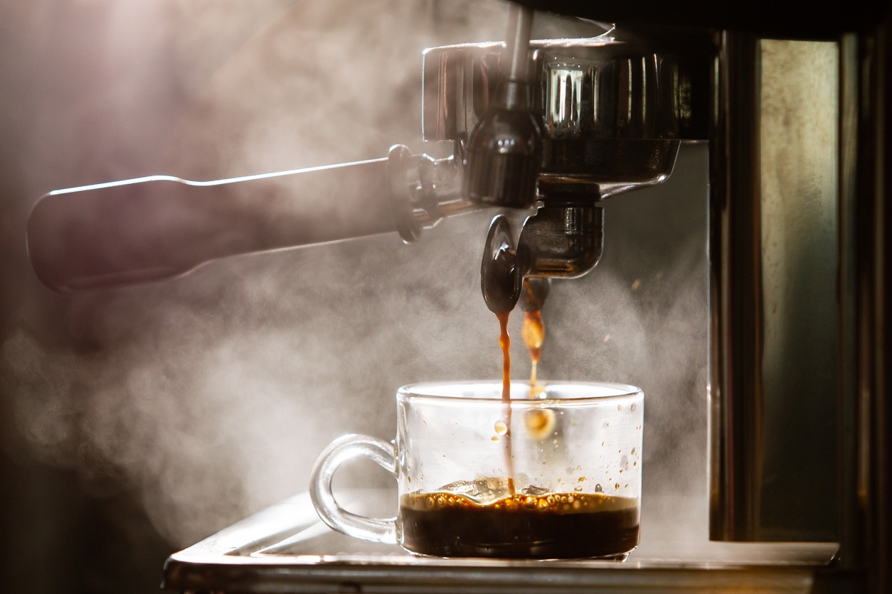 An espresso machine brewing fresh coffee