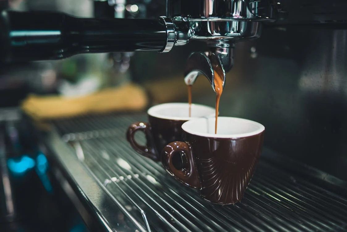 Brewing coffee beans in an espresso machine
