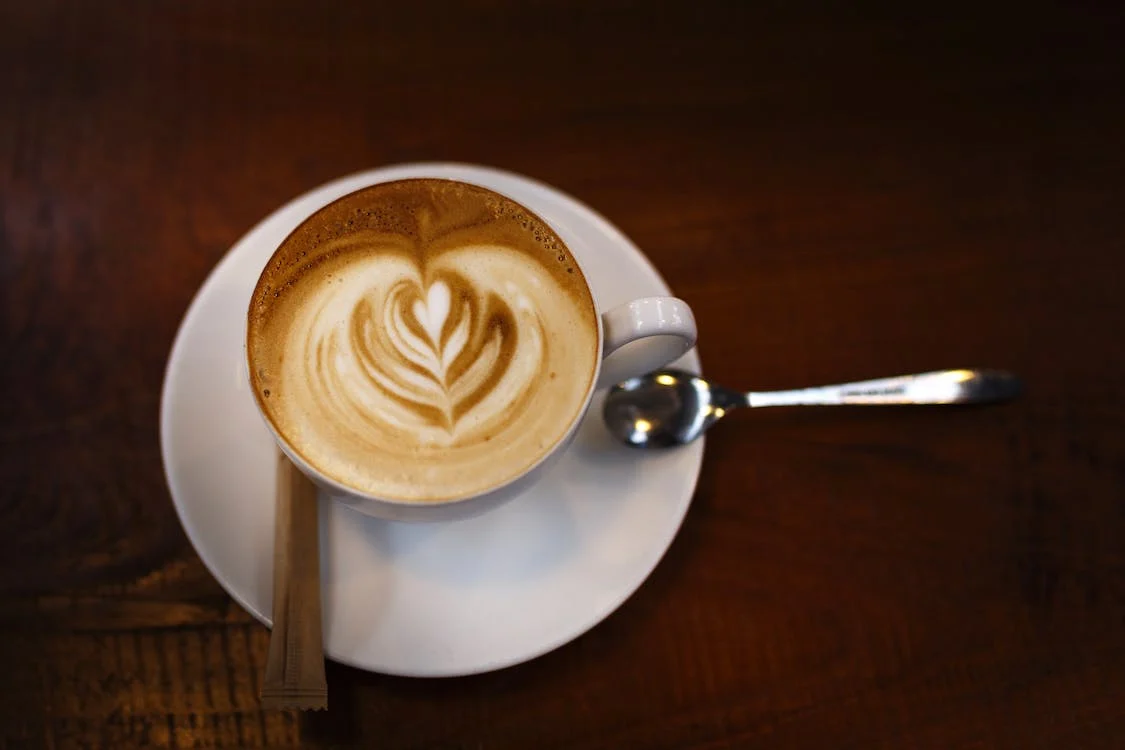Rosetta latte art design on cup of coffee