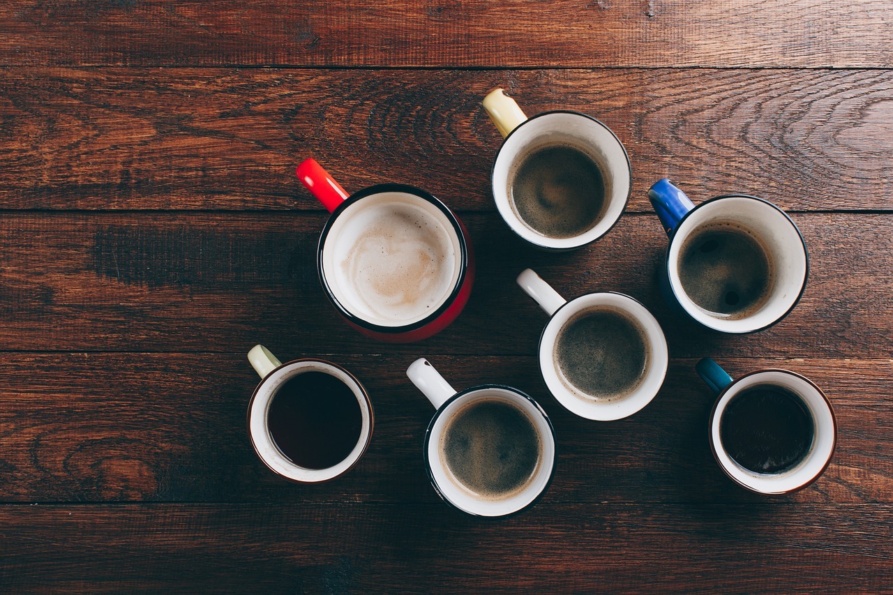 top view shot of different cups of coffee on table